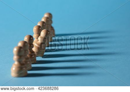 Chess Pieces In A Row, White Pawns On A Blue Background,