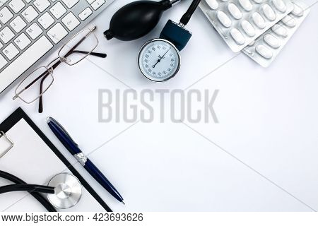 Flatlay Composition With Pulsimeter, Pills, Medical Stethoscope And Clipboard On White Background. T