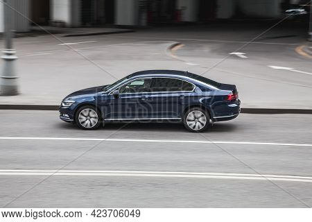 Moscow , Russia - May 2021: Car Driving Fast Motion On The Highway, Side View. Gray Volkswagen Passa