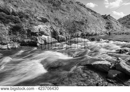 Long Exposure Of The River Heddon Flowing Into Heddons Mouth On The North Devon Coast