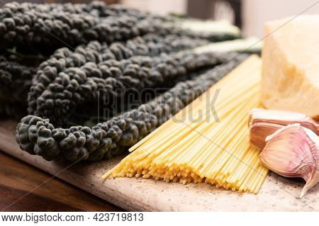 Cooking With Black Flat Leaves Of Cavolo Nero Tuscan Cabbage