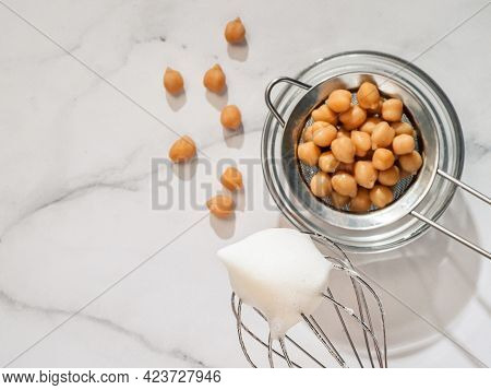 Whipped Aquafaba On Planetary Mixer Whisk, Vertical. Chickpea Water Brine Aquafaba Whipped. Egg Repl
