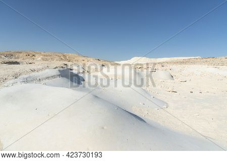 Beautiful Lunar Landscape. Wight And Smooth Hills In Various Shapes In A Desert Landscape. The Whiti