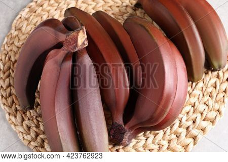 Delicious Red Baby Bananas On Wicker Mat, Top View
