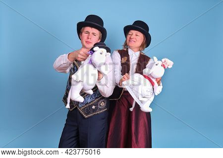 Actors With Moomin Troll Dolls On A Blue Background - Moscow, Russia, April 28, 2021