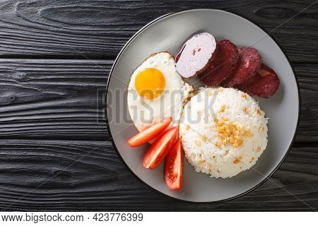 Filipino Breakfast Sinangag Garlic Rice With Fried Egg And Meat Close-up In A Plate On The Table. Ho