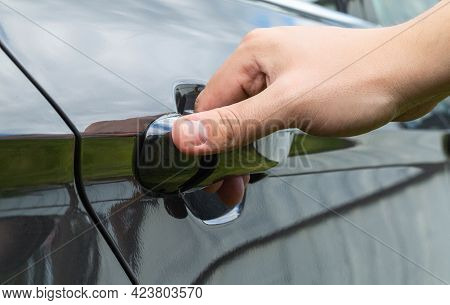 A Mans Hand Opens A Car Door. Car Theft Concept, Macro. Lifestyle
