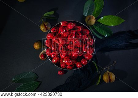 Nutmeg Seeds In Round Pot - Leaf And Cloths - Dark Background, Nutmeg Fruits And Seeds On Dark Backg