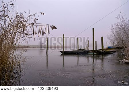 Boats In A Frozen Creek Near Hank
