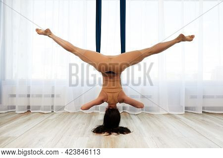 View From The Back, A Young Woman During Training In An Iro Hammock, Doing Anti-gravity Yoga Upside 