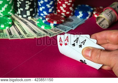Poker Cards With With Four Of A Kind Win Combination. Close Up Of Gambler Hand Takes Playing Cards I