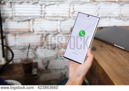 Chiang Mai, Thailand - June 06, 2021 : Woman Holding Smartphone Mobile And Open Appstore Searching S