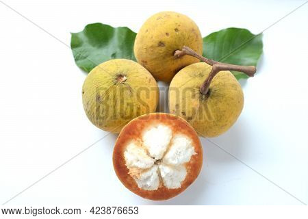 Fresh Half Santol Fruit, Ripe Santol And Green Santol Leaves Isolate On White Background