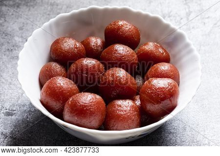 Top View Of Group Of Tasty Gulab Jamuns, Indian Sweets In A Bowl