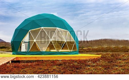 Green Geodome Tent. Cozy, Camping, Glamping, Holiday, Vacation Lifestyle Concept.