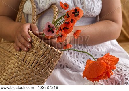 Woman In White Dress Holding Poppe Flowers, Close Up On Her Hands. Spring Time Dreams.