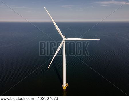 Wind Turbine From An Aerial View, Drone View At Windpark A Windmill Farm In The Lake Ijsselmeer The 