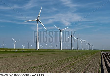 Wind Turbine From An Aerial View, Drone View At Windpark A Windmill Farm In The Lake Ijsselmeer The 