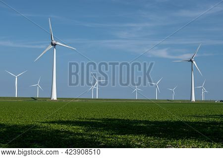 Wind Turbine From An Aerial View, Drone View At Windpark A Windmill Farm In The Lake Ijsselmeer The 