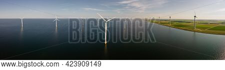 Wind Turbine From An Aerial View, Drone View At Windpark A Windmill Farm In The Lake Ijsselmeer The 