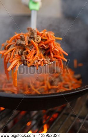 Closeup Photo Of Pilaff In Kettle On Fire