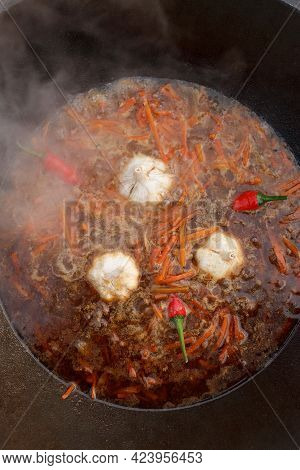 Boiling Carrots, Garlic, Red Pepper For Pilaff