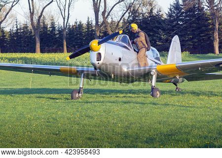 The Pilot Of A Small Light Aircraft Is Getting Ready To Fly.