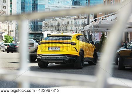 Kiev, Ukraine - May 22, 2021: Yellow Luxury Super Suv Lamborghini Urus In The City. Lamborghini Urus