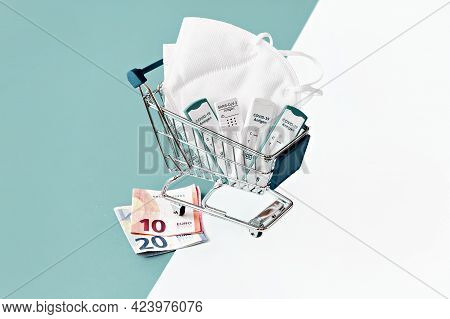Cost Of Shnelltest, Rapid Corona Test In German Language. Shopping Cart With Covid 19 Antigen Tests 