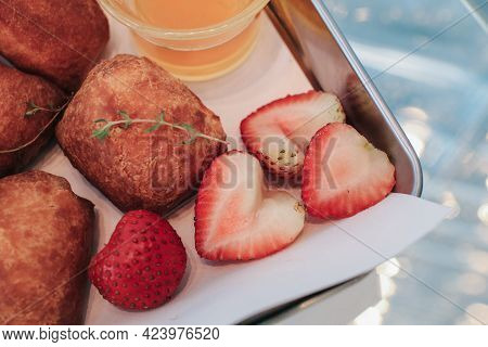 Traditional French Beignets Doughnuts With Strawberry And Powdered Sugar.