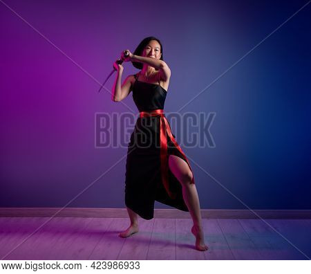 Slender Asian Woman In A Black Dress With A Katana In Her Hand Image Of A Samurai On A Neon Backgrou
