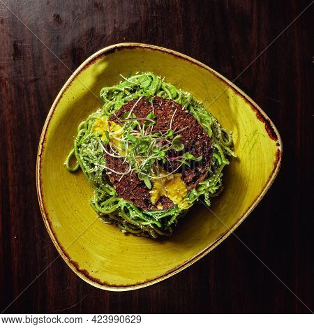 The Green Noodles With A Loaf Of Dietic Bread On Top