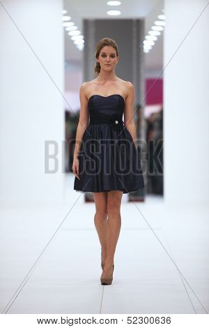 ZAGREB, CROATIA - OCTOBER 12: Fashion model in cocktail dress made by Lorien on 'Wedding Expo' show in the Westgate Shopping City in Zagreb, Croatia on October 12, 2013