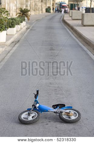 Abandoned Kids Bike On Deserted Road