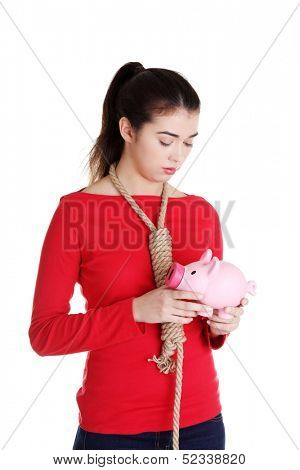 Economic crisis concept. Young woman holding piggy bank going to commit suicide. 