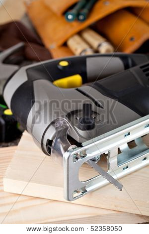 electric fretsaw on a wooden table
