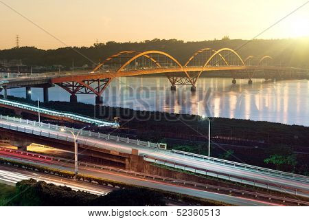 Urban day to night, famous Guandu Bridge in Taipei, Taiwan, Asia. Photo manipulation.