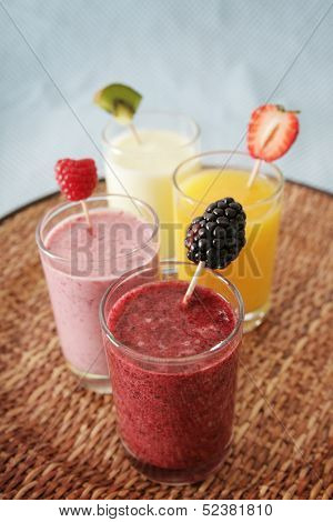 Four different smoothies in a tray
