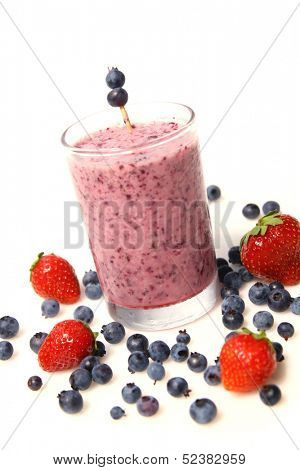 Blueberry smoothie and fresh fruits isolated on a white background