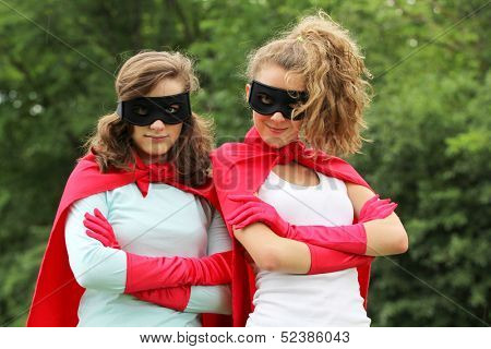 Super team of super hero girl with red cape and red gloves