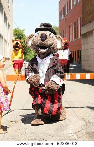 GRANBY, QUEBEC, CANADA- JULY 22: Mascot Festival in Granby, Quebec. Five day Annual family event with a Mascot parade. Koko meets children during the festival on July 22, 2012 in Granby, Quebec, Canada