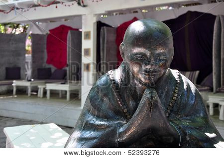 Interior Of Open Air Restaurant With Big Buddha Bronze Sculpture. Budva, Montenegro