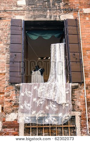 Venetian lace at the open window