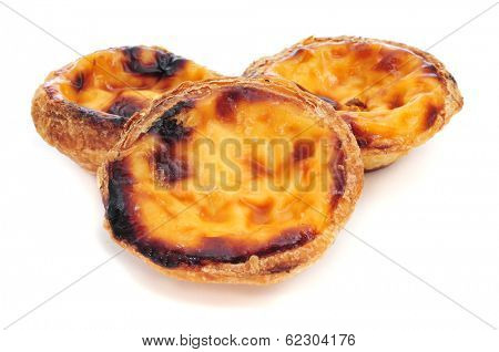 some pasteis de nata, typical Portuguese egg tart pastries, on a white background
