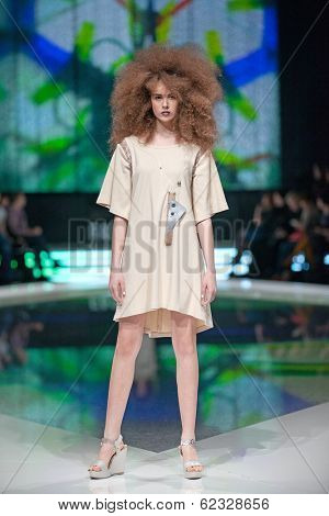 ZAGREB, CROATIA - MARCH 28, 2014: Fashion model wearing clothes designed by Marina Design and Marija Ivanovic jewelry on the 'Fashion.hr' fashion show