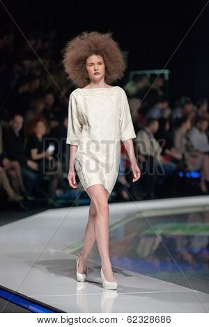 ZAGREB, CROATIA - MARCH 28, 2014: Fashion model wearing clothes designed by Marina Design and Marija Ivanovic jewelry on the 'Fashion.hr' fashion show