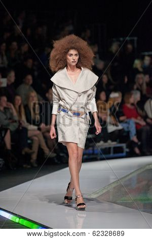 ZAGREB, CROATIA - MARCH 28, 2014: Fashion model wearing clothes designed by Marina Design and Marija Ivanovic belt on the 'Fashion.hr' fashion show