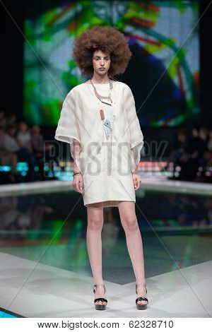 ZAGREB, CROATIA - MARCH 28, 2014: Fashion model wearing clothes designed by Marina Design and Marija Ivanovic jewelry on the 'Fashion.hr' fashion show