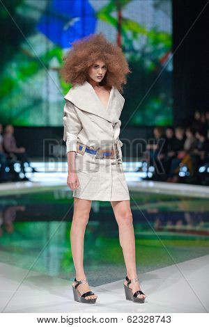ZAGREB, CROATIA - MARCH 28, 2014: Fashion model wearing clothes designed by Marina Design and Marija Ivanovic belt on the 'Fashion.hr' fashion show