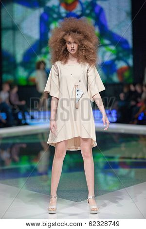 ZAGREB, CROATIA - MARCH 28, 2014: Fashion model wearing clothes designed by Marina Design and Marija Ivanovic jewelry on the 'Fashion.hr' fashion show